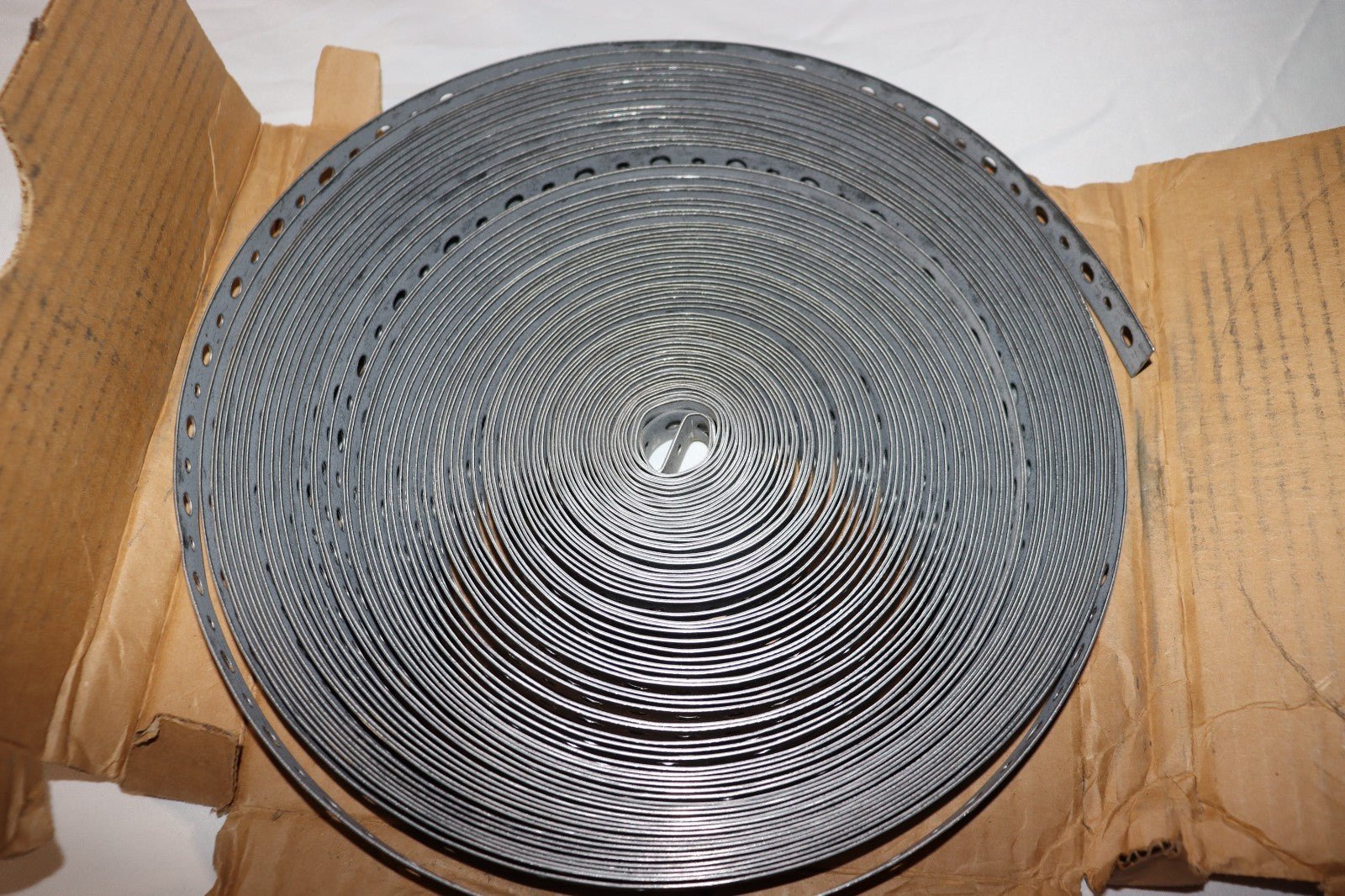 DMC 20P100 Hanging Strap Iron 100 Feet Length Galvanized Steel 20GA - Northside Material Brokers